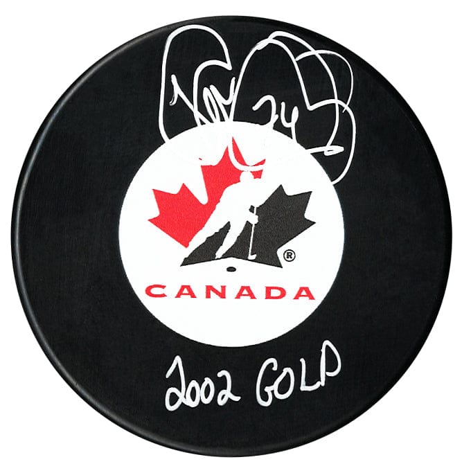 Theo Fleury Autographed Team Canada 2002 Gold Inscribed Puck CoJo Sport Collectables Inc.