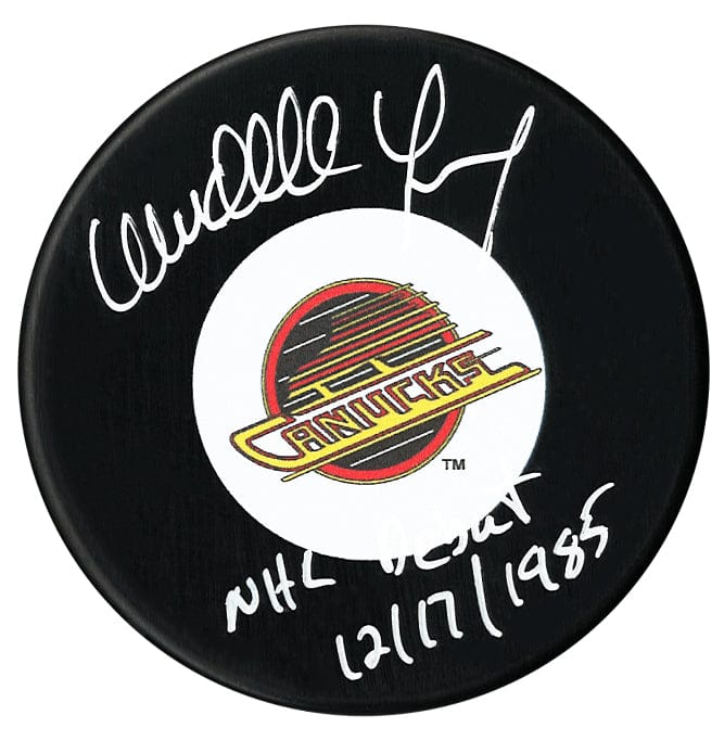 Wendell Young Autographed Vancouver Canucks Debut Inscribed Puck CoJo Sport Collectables Inc.
